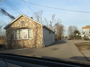 That's right:  That house IS in the middle of the road.