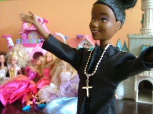 My daughter's Barbie in clergy stole helps her play "church."  Last weekend, the Barbie did a funeral for a tadpole that died before its time.
