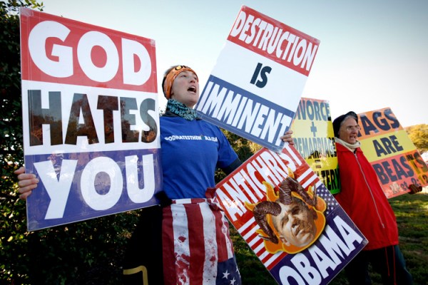 Members of the Westboro Baptist Church hold anti-gay signs at Arlington National Cemetery in Virginia on Veterans Day, November 11, 2010. REUTERS/Kevin Lamarque (UNITED STATES - Tags: POLITICS) - RTXUI58